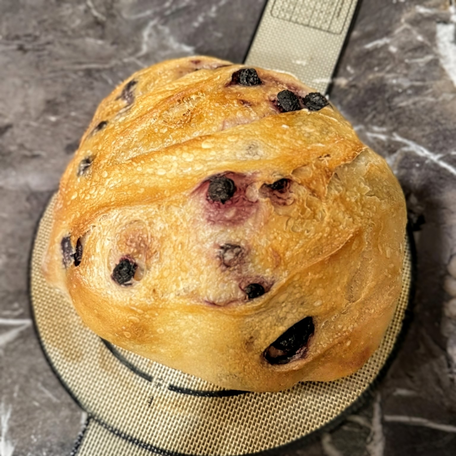 A loaf of artisanal sourdough bread with a perfect crust